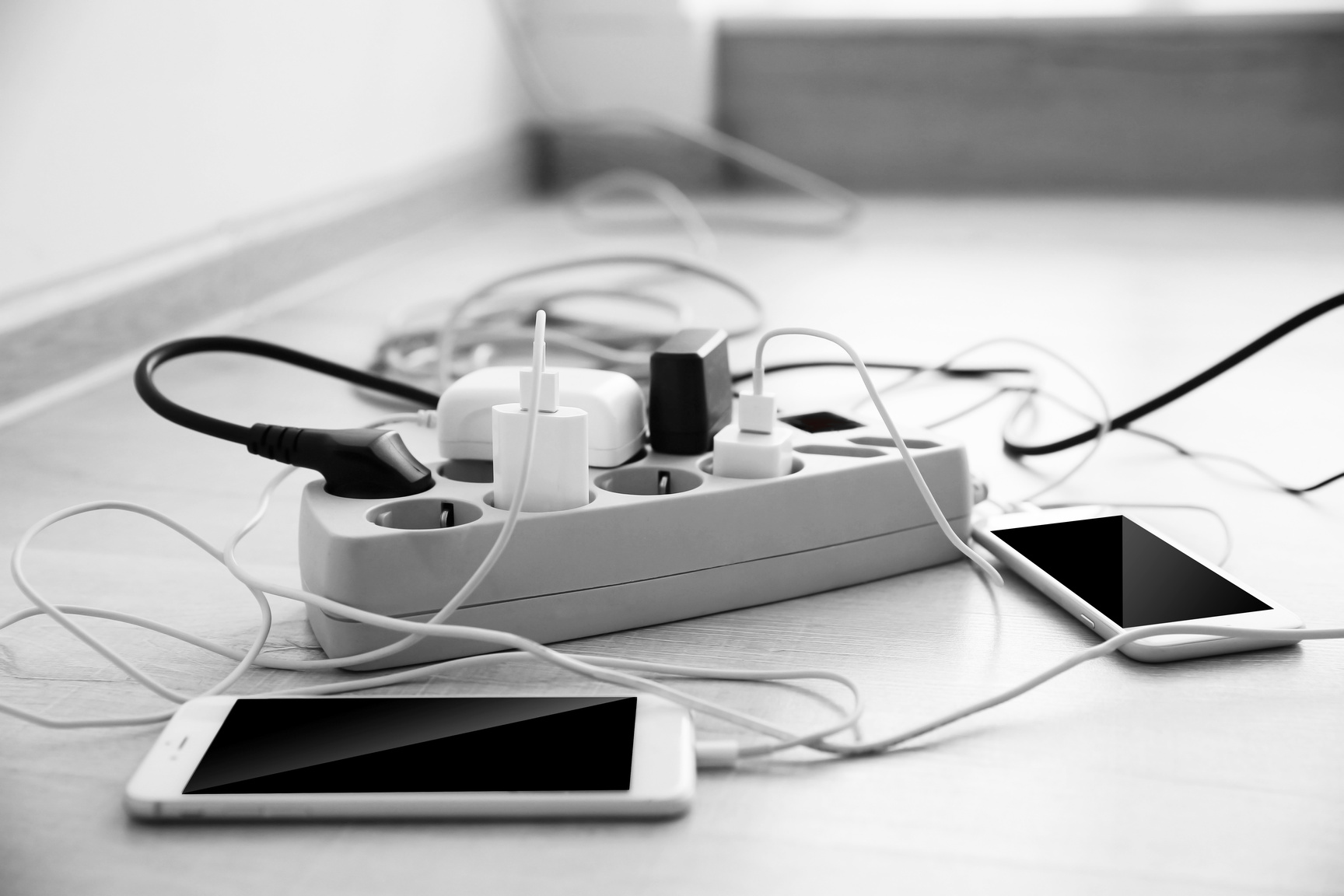 Smartphones Charging on a Power Extension Cord 